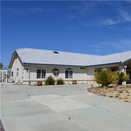 Rent this 4 bed house on 13628 Cronese Road in Sunset Hills, Apple Valley