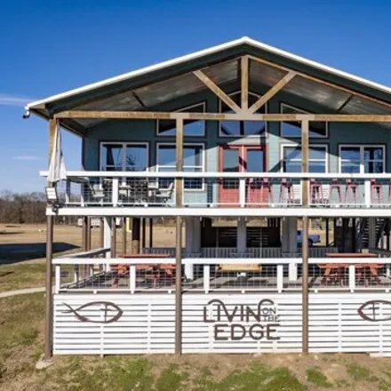 Buy this 5 bed house on The WhiteWater on the Caddo River in 146 Serenity Loop, Glenwood