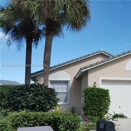 Rent this 3 bed house on 111 Harbor Lake Circle in Greenacres, FL 33413