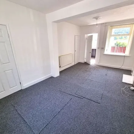 Rent this 3 bed townhouse on Victoria Street in Miskin, CF45 3AY