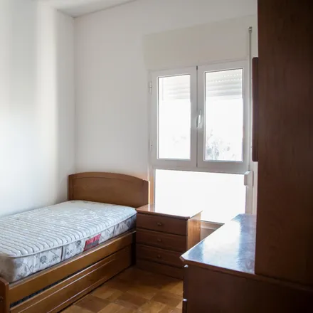 Rent this 4 bed room on Avenida de Berlim 83 in 1800-111 Lisbon, Portugal