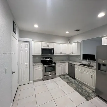 Buy this 3 bed townhouse on 5563 Northwest 90th Avenue in Sunrise, FL 33351