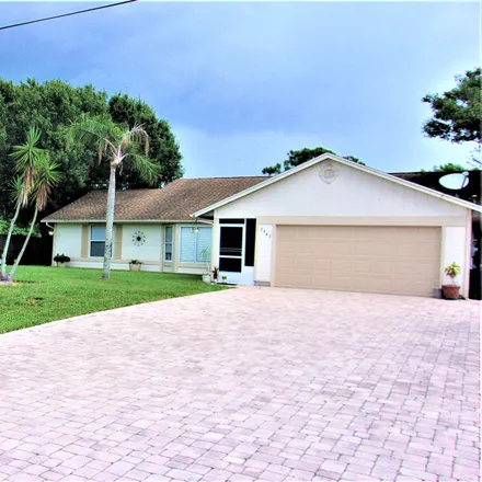 Buy this 3 bed house on 2447 Southwest Page Circle in Port Saint Lucie, FL 34953