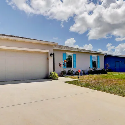 Buy this 3 bed house on 1044 Southeast Lansdowne Avenue in Port Saint Lucie, FL 34983