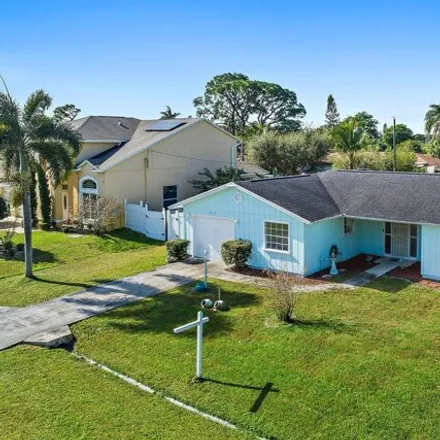 Buy this 3 bed house on 2444 Southeast Sidonia Street in Port Saint Lucie, FL 34952