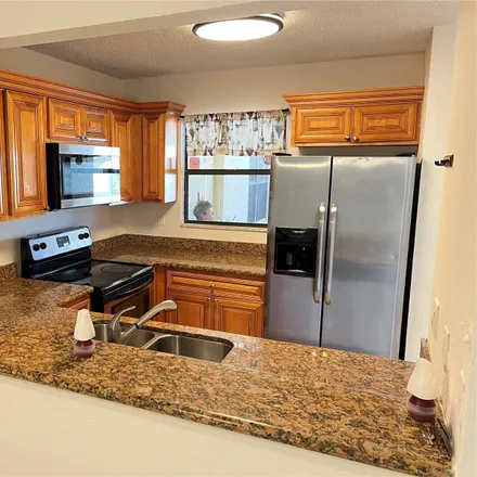 Rent this 2 bed condo on Golden Lakes in FL, US