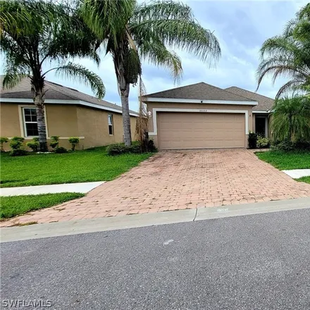 Rent this 3 bed house on 10353 Canal Brook Lane in Lehigh Acres, FL 33936