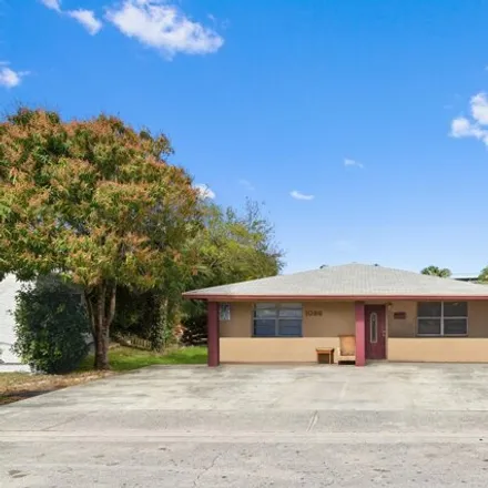 Buy this 9 bed house on 1054 West 31st Street in Riviera Beach, FL 33404