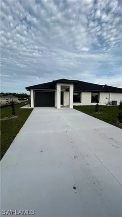 Rent this 2 bed house on 1903 Richmond Avenue North in Lehigh Acres, FL 33972