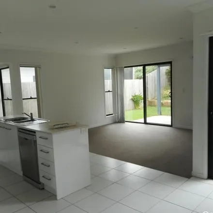 Rent this 3 bed townhouse on Chrome Drive in Pimpama QLD 4209, Australia