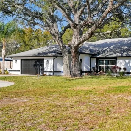 Buy this 4 bed house on 1242 Huntington Avenue in Spring Hill, FL 34609