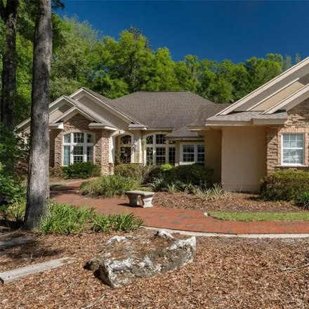 Buy this 5 bed house on 10722 Southwest 27th Avenue in Gainesville, FL