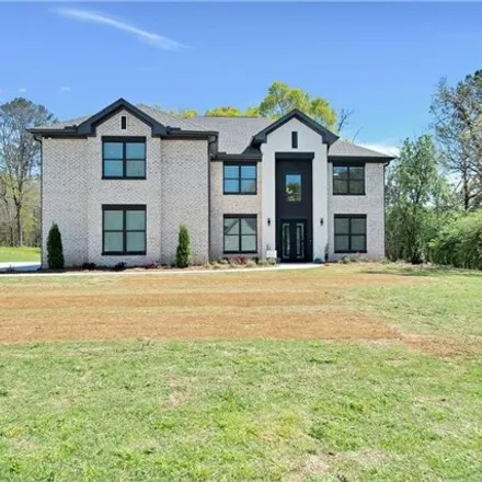 Buy this 5 bed house on 3018 Flat Shoals Rd Sw in Conyers, Georgia