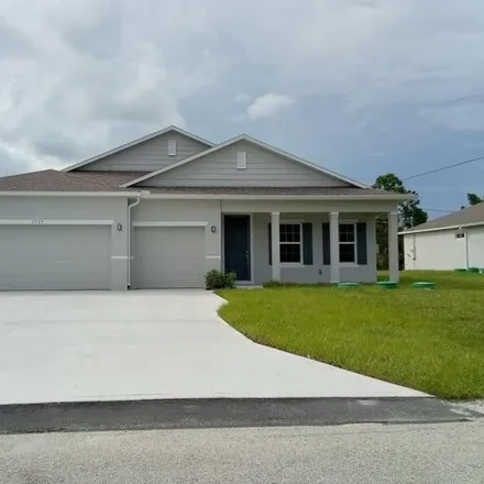 Buy this 4 bed house on 1518 Painter Street Southeast in Palm Bay, FL 32909