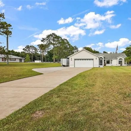 Buy this 3 bed house on 36130 S Grays Airport Rd in Fruitland Park, Florida