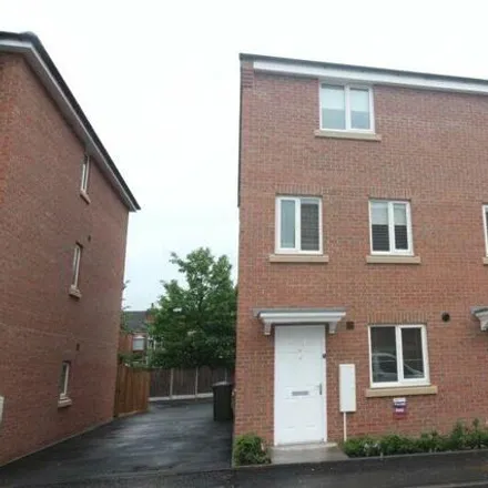 Rent this 4 bed townhouse on 35 Signals Drive in Coventry, CV3 1QS
