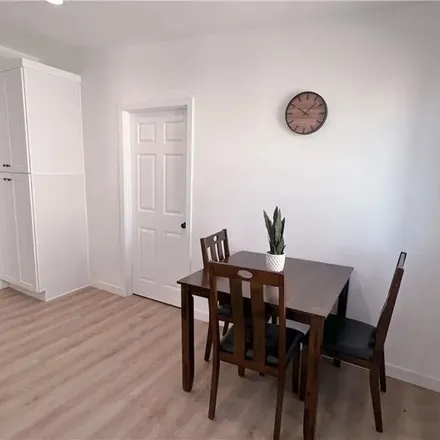 Rent this 3 bed apartment on 1481 South Cloverdale Avenue in Los Angeles, CA 90019