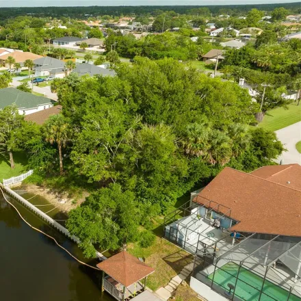 Buy this studio house on Club Field Drive in Palm Coast, FL 32137