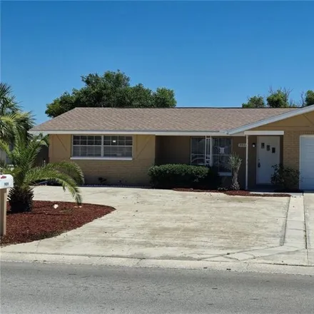 Buy this 3 bed house on 7824 Jasmine Boulevard in Jasmine Estates, FL 34668