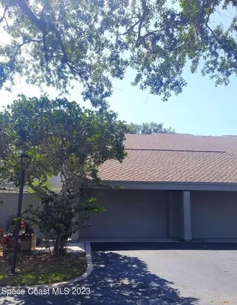Rent this 3 bed house on 892 Aquarina Boulevard in Evans Pines, Brevard County