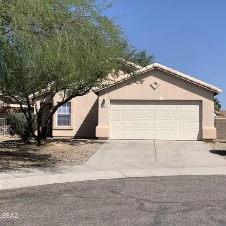 Rent this 4 bed house on 4400 West Holly Berry Drive in Pima County, AZ 85741