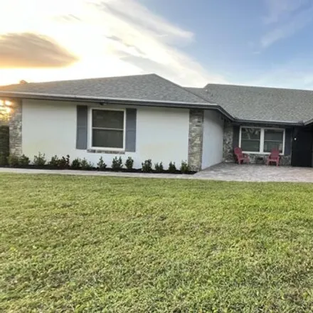 Rent this 3 bed house on 13702 Exotica Lane in Wellington, FL 33414