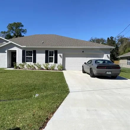 Buy this 4 bed house on 730 Southwest Aster Road in Port Saint Lucie, FL 34953