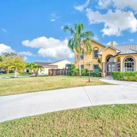 Buy this 4 bed house on 2576 Southwest Barber Lane in Port Saint Lucie, FL 34984