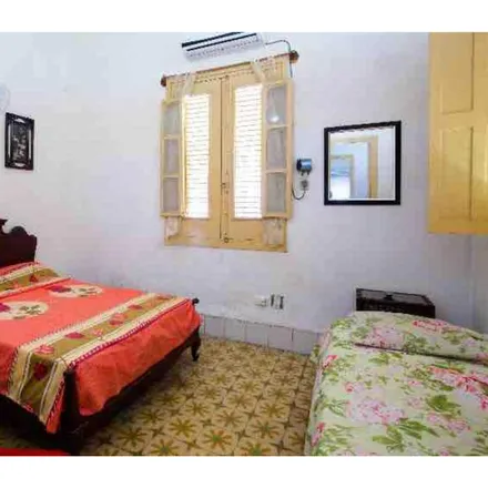 Rent this 2 bed room on Servicio de impresión y fotografía in Calle 4, Havana