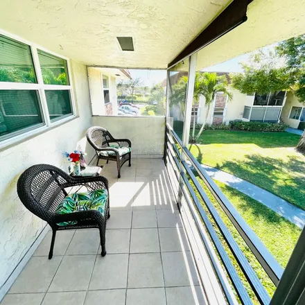 Rent this 2 bed apartment on 9952 Three Lakes Circle in Palm Beach County, FL 33428