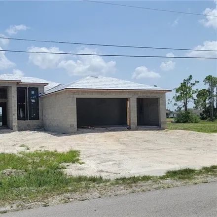 Buy this 4 bed house on 3237 Kismet Parkway West in Cape Coral, FL 33993