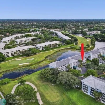 Buy this 2 bed condo on Pine Island Ridge Golf Course in 9400 Poinciana Place, Pine Island Ridge