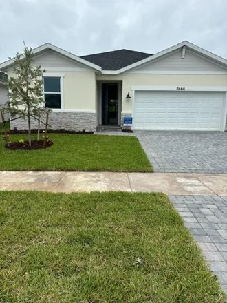 Rent this 4 bed house on Southwest Commerce Centre Drive in Port Saint Lucie, FL 34986