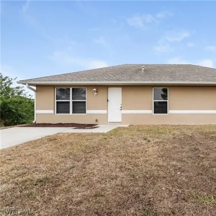 Rent this 4 bed house on 1199 Barfield Street in Lehigh Acres, FL 33974