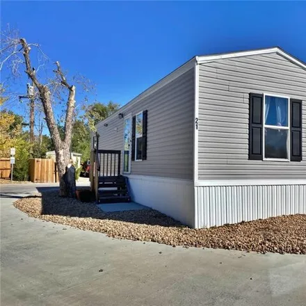 Buy this studio apartment on 6900 Old State Highway 2 in Adams City, Commerce City