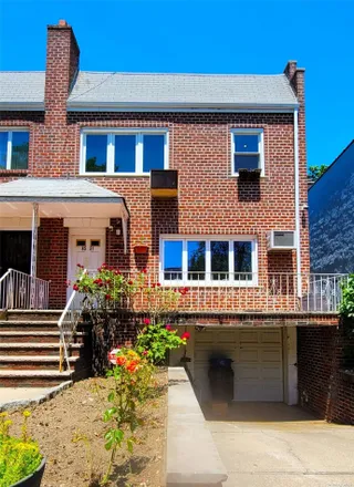 Buy this 5 bed townhouse on 85-51 67th Drive in New York, NY 11374