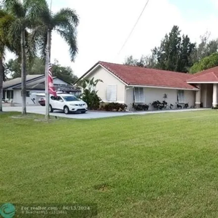 Buy this 4 bed house on 5011 SW 111th Ter in Davie, Florida