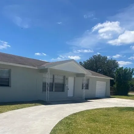 Buy this 3 bed house on 692 Date Palm Drive in Lake Park, Palm Beach County