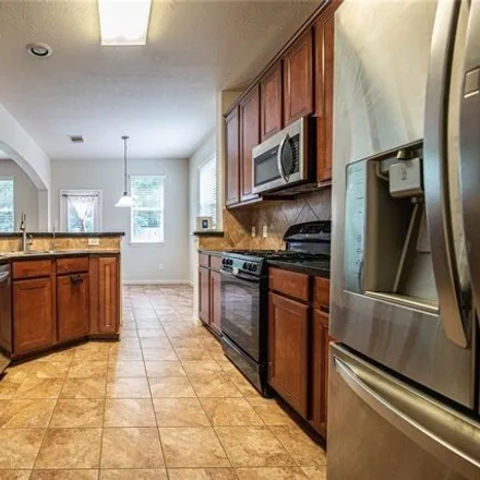 Rent this 4 bed house on 21698 Redcrested Glen Court in Rotherwood, Harris County