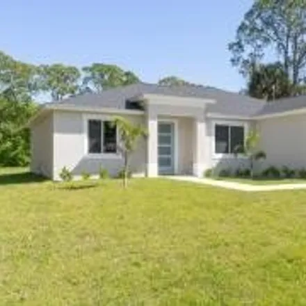 Buy this 4 bed house on 3227 Southeast Trainfo Avenue in Palm Bay, FL 32909