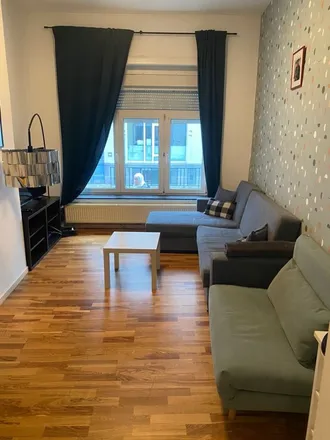 Rent this 3 bed apartment on Rue T'Kint - T'Kintstraat 17 in 1000 Brussels, Belgium