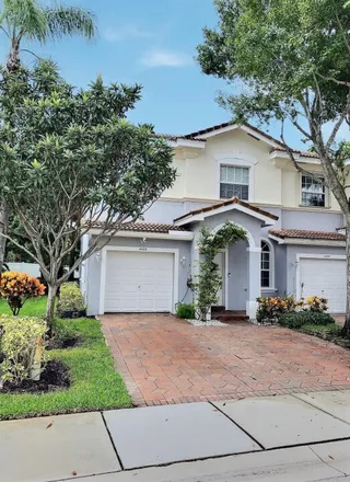 Buy this 4 bed townhouse on 4420 Regal Court in Delray Beach, FL 33445