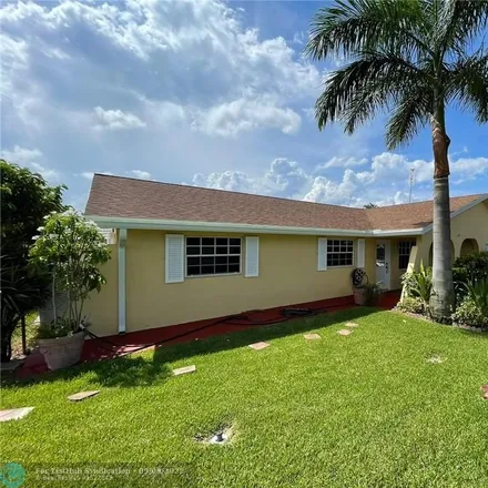 Rent this 4 bed house on 2199 Wellington Road in Westgate-Belvedere Homes, West Palm Beach