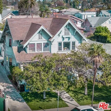 Buy this 9 bed house on 3576 West 21st Street in Los Angeles, CA 90018