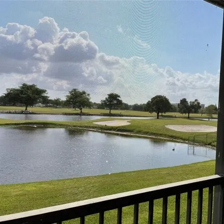 Rent this 2 bed condo on 3138 Rolling Hills Circle in Davie, FL 33328