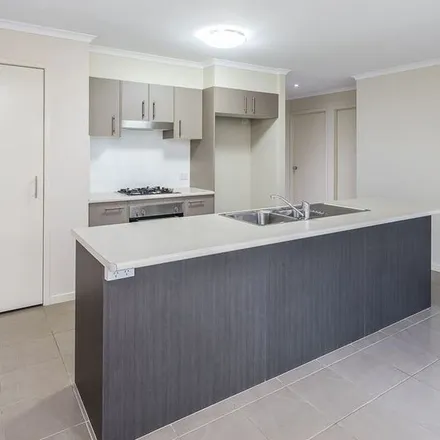 Rent this 4 bed apartment on 75 Daintree Circuit in North Lakes QLD 4509, Australia