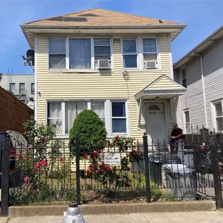 Buy this 8 bed house on 35-64 91st Street in New York, NY 11372