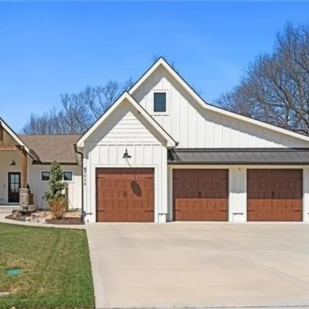 Buy this 4 bed house on 4842 Northeast Jamestown Drive in Lee's Summit, MO 64064