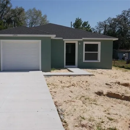 Buy this 3 bed house on 1699 Tangelo Street in Polk County, FL 33898