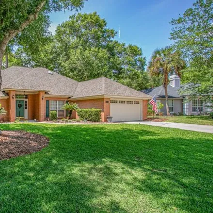 Buy this 4 bed house on 1864 Plantation Oaks Drive in Jacksonville, FL 32223
